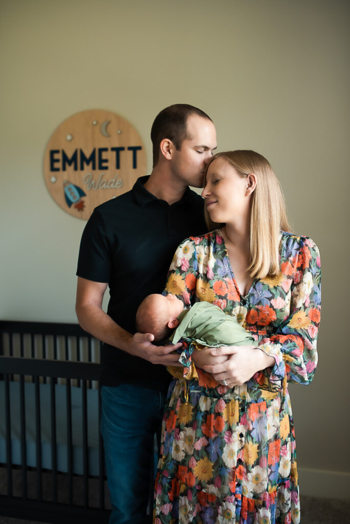 lifestyle newborn session with mom holding baby boy