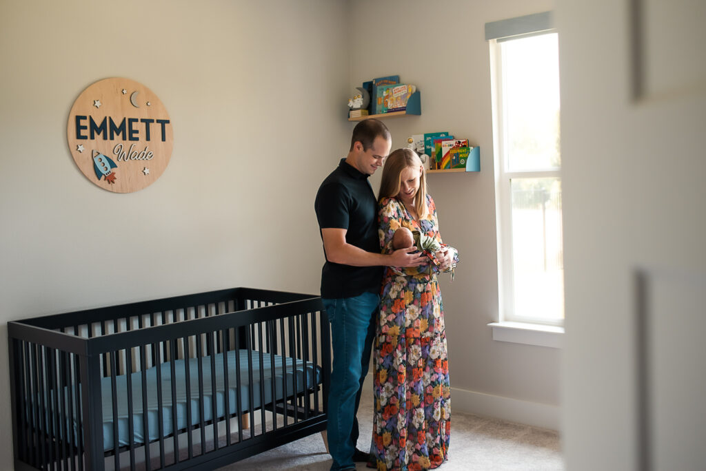 lifestyle newborn session with mom holding baby boy