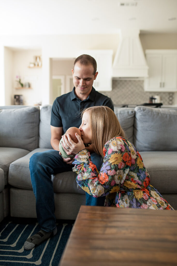 lifestyle newborn session with mom holding baby boy