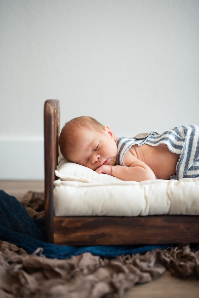 lifestyle newborn session with mom holding baby boy