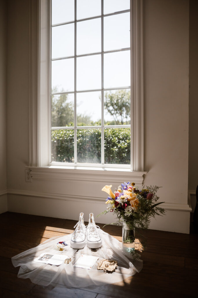 detail shot of the brides accesories in the light shining through the window at milestone denton captured by shelly voss