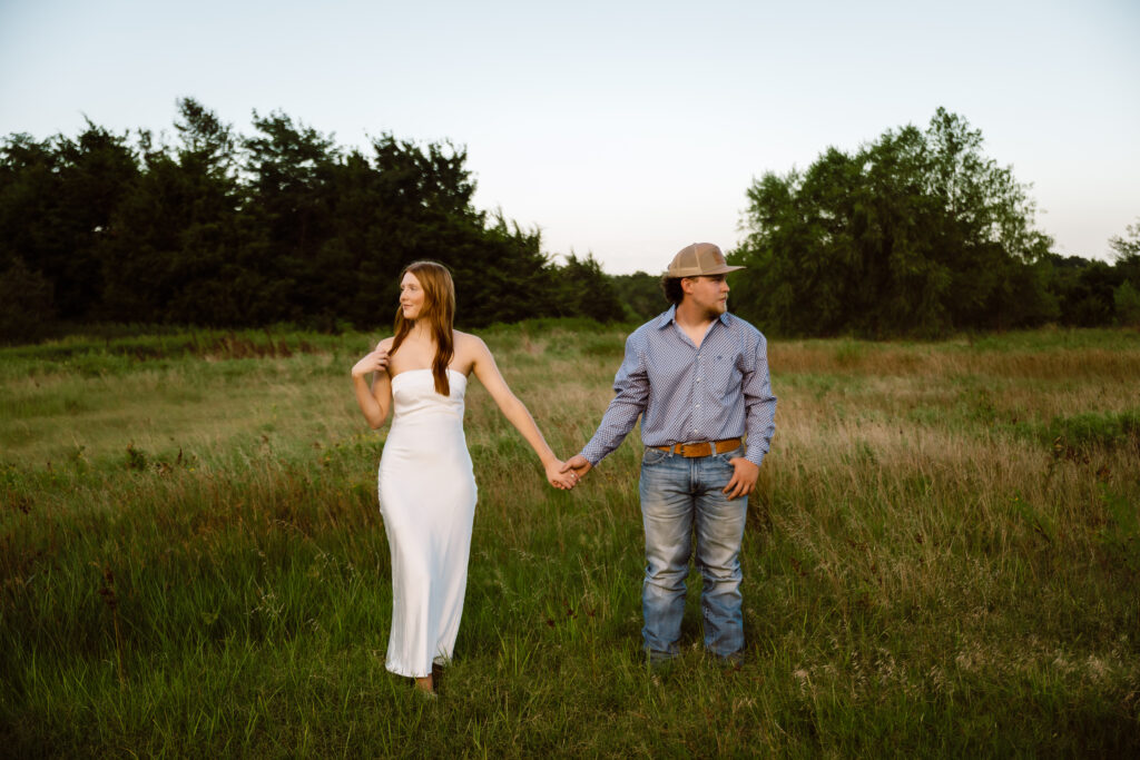 Picture of a couple holding hands during blue hour photography session captured by Shelly Voss photography