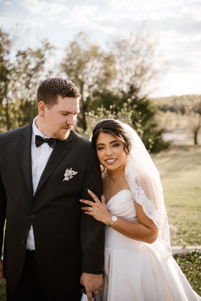 groom admires his brides
