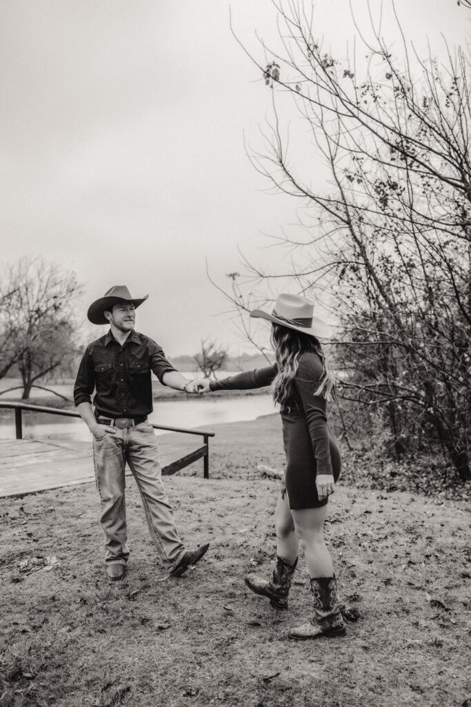 couple dances during their engagement session at Avalon legacy ranch in mckinney,tx