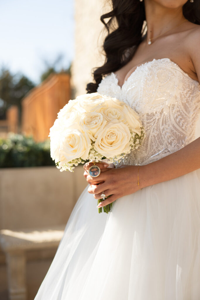 bride holds her bouquet close while shelly voss photography captures the moment