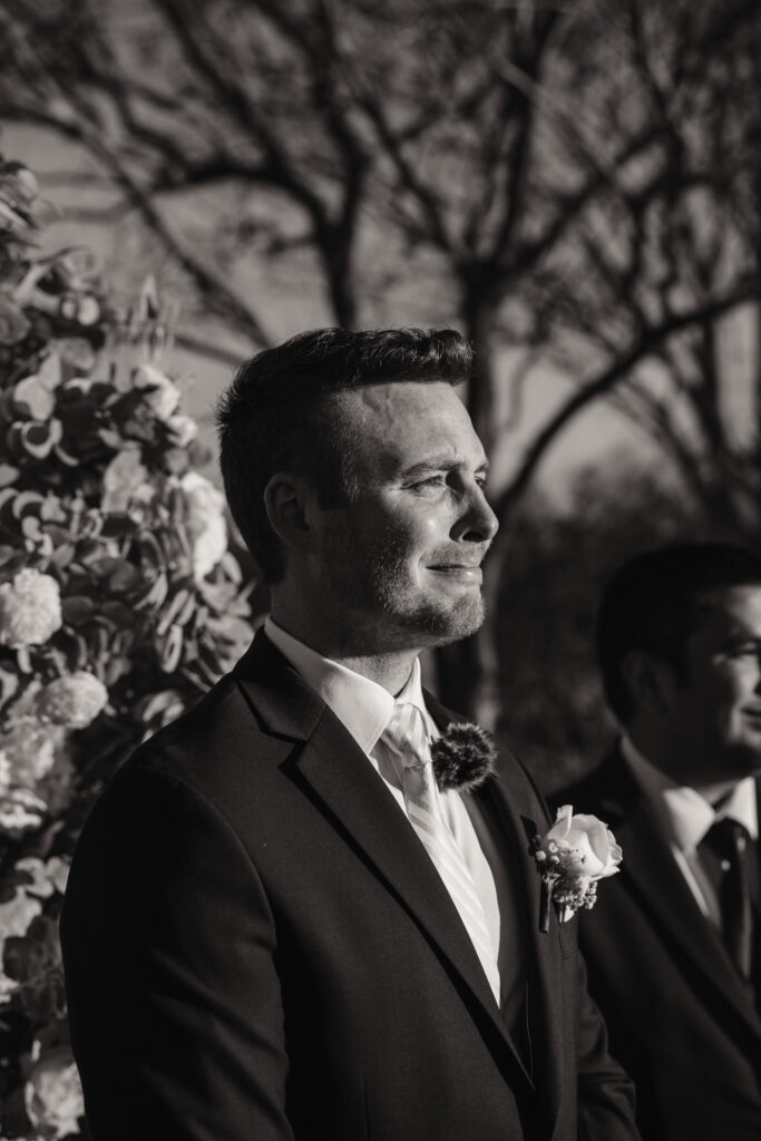 groom sheds a tear watching his bride walk down the iasle in an emotional moment captured by shelly voss
