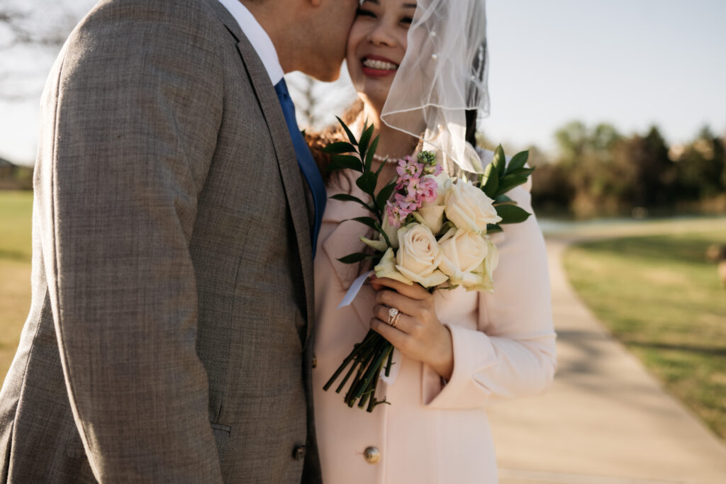 couple cuddles during their photo session with shelly voss photography at their elopement in rockwall,texas.

