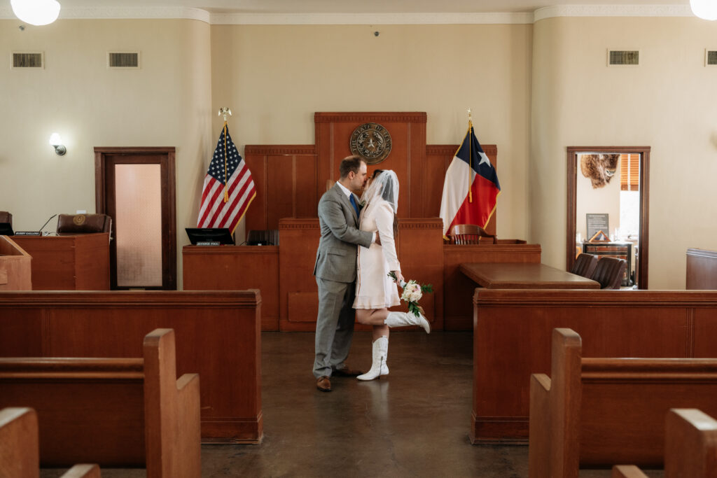 couple says i do in the historic rockwall courthouse during their elopement captured by shelly voss photography.