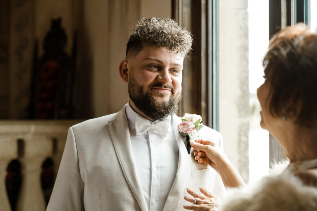 Groom waiting at the altar inside Bella Donna Chapel during an intimate McKinney wedding ceremony