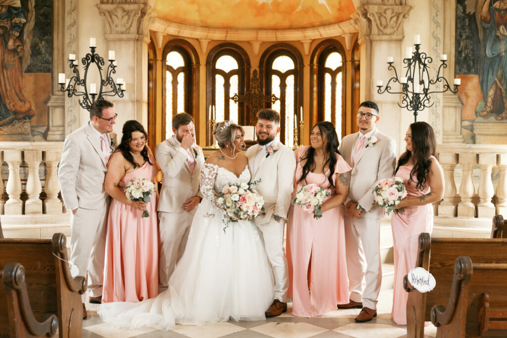 Evening exterior view of illuminated Bella Donna Chapel during a romantic wedding celebration in Adriatica