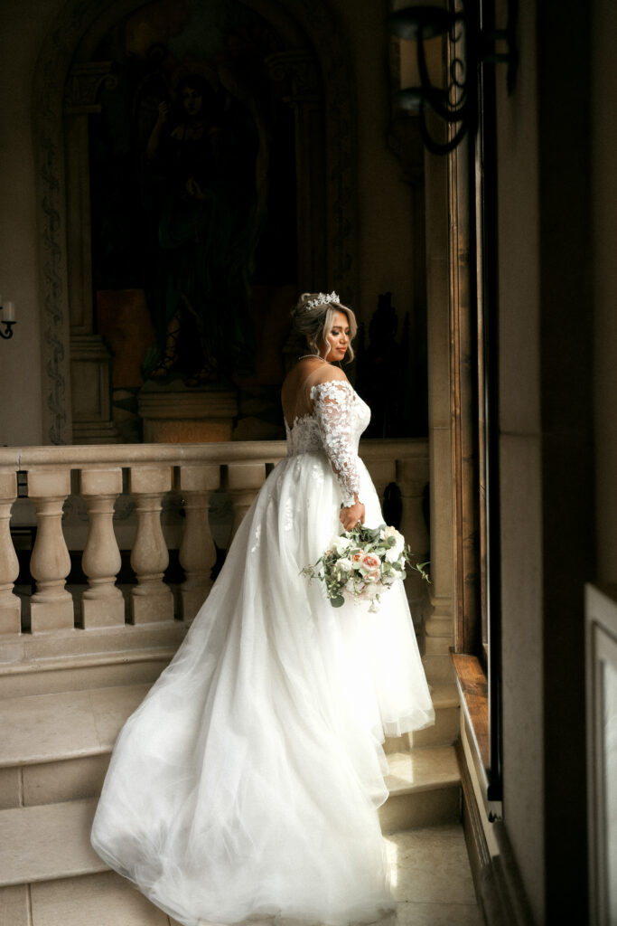 Bride getting ready in the bell tower at Bella Donna Chapel before her wedding ceremony in McKinney Texas