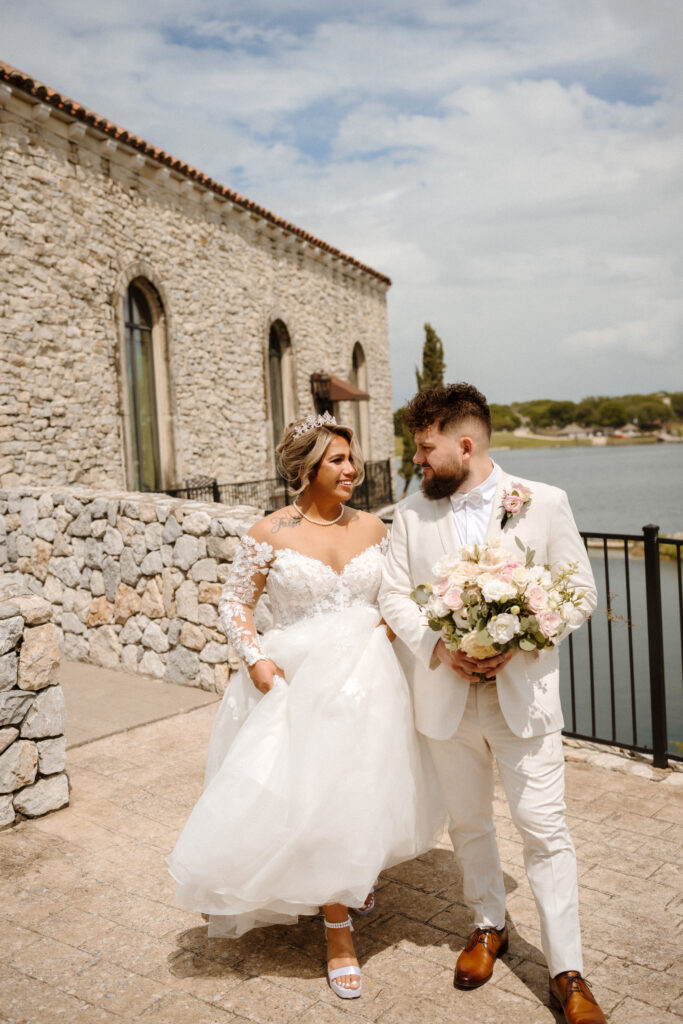 Newly married couple exiting Bella Donna Chapel after ceremony surrounded by family celebration