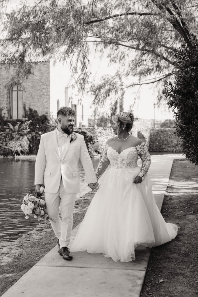 Bride and groom sunset portraits near the waterfront in Adriatica after Bella Donna Chapel wedding ceremony